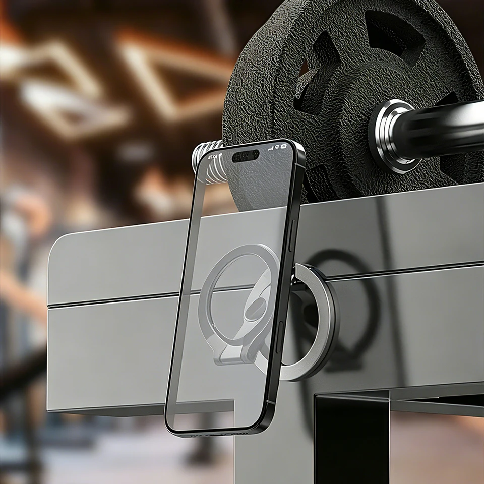 Phone held by the magnetic ring on a steel gym machine
